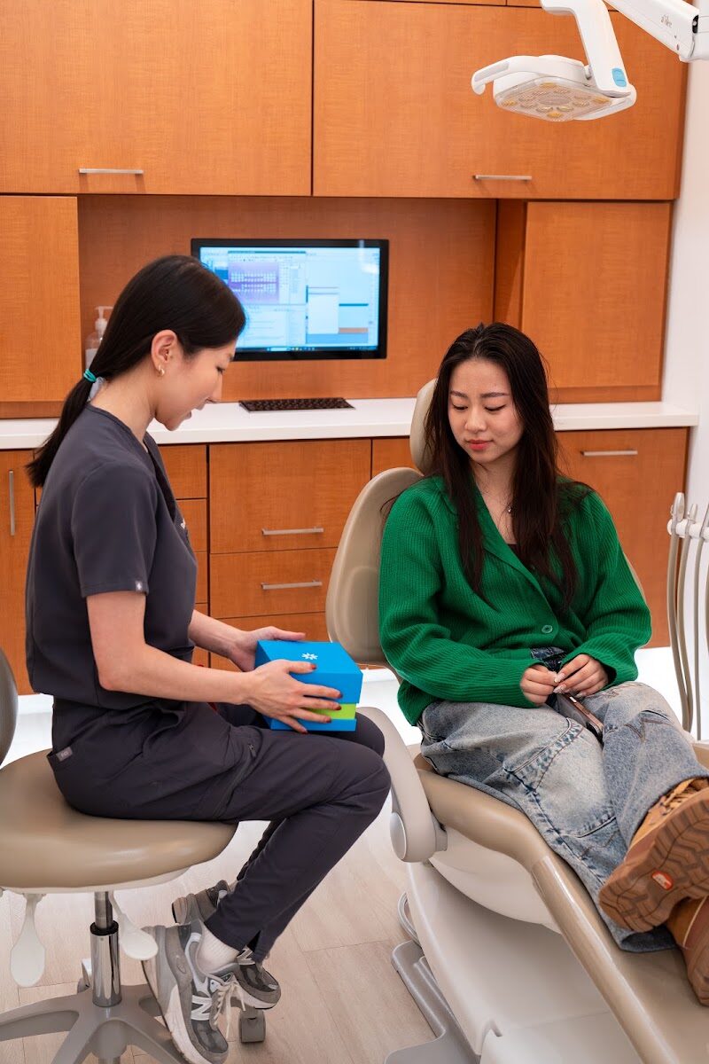 Kingsview Dental team member guiding a patient through Invisalign