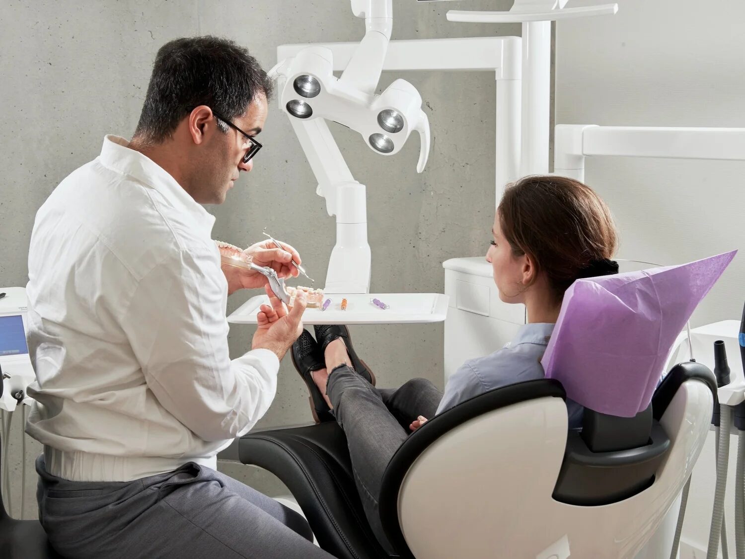 Kingsview Dental dentist talking with a patient